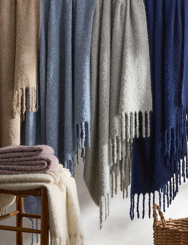 A photo of Poncho throws draped together.