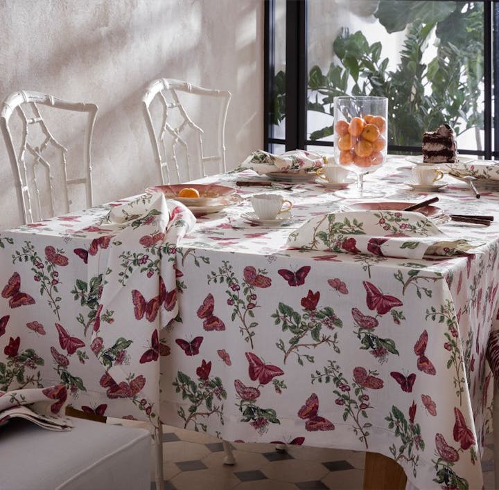 A table featuring Baudin Butterfly, a Matouk Schumacher print.