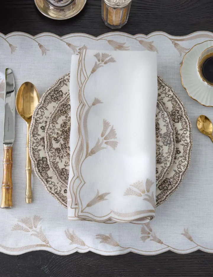 An overhead view of a green Laksha Table Place Setting