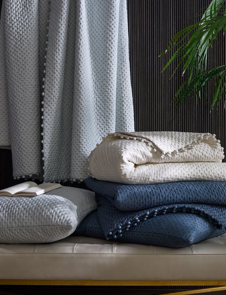 A photo of the Margaret Quilt in a stack.