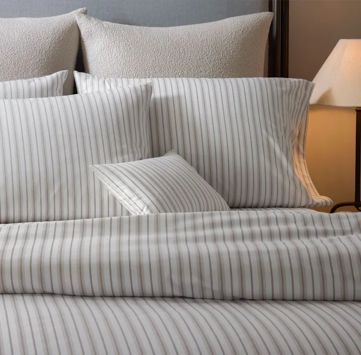 A bed featuring Calypso bed linens