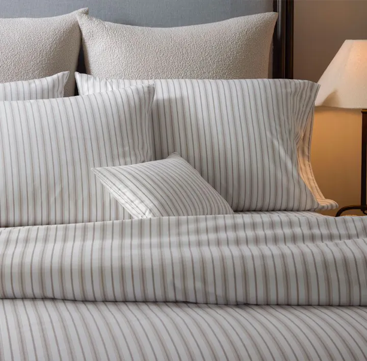 A bed featuring Calypso bed linens