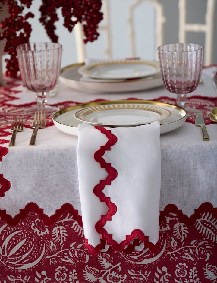 The side of a table showing the Granada tablecloth and Aziza napkins.
