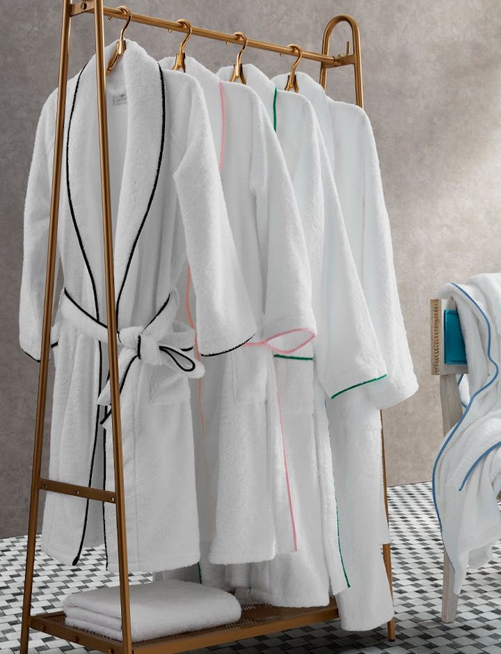 A view of several Cairo Robes hanging on a clothing rack