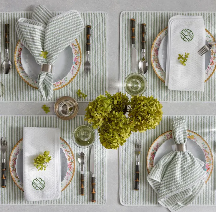 A closeup of a place setting featuring Matteo linens