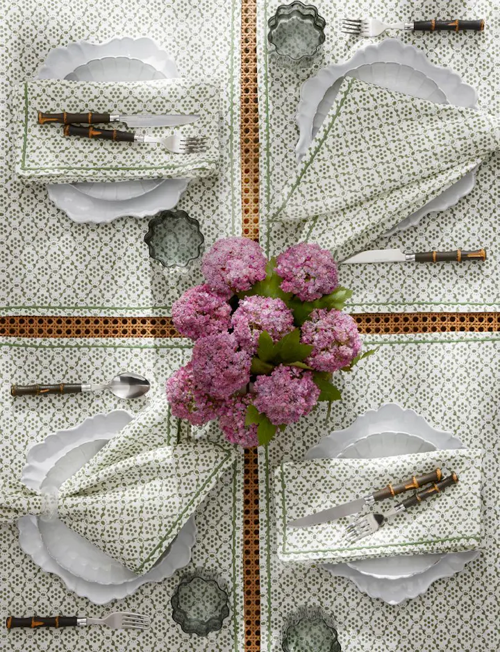 An overhead view of a green Laksha Table Place Setting