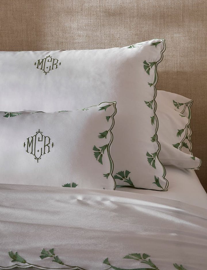 A bed featuring Matouk's Marcella style.