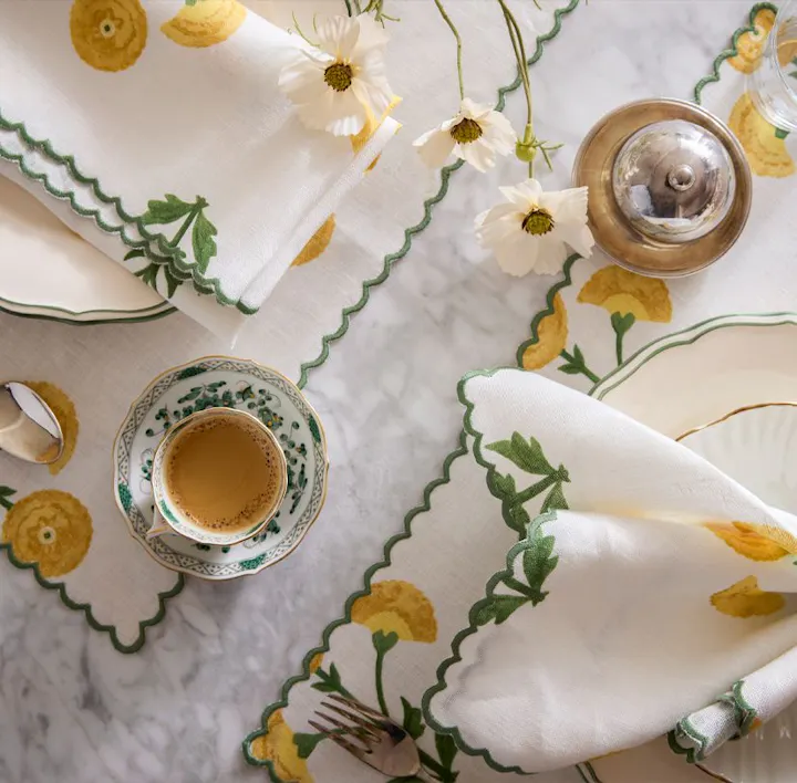 A closeup of a place setting featuring Gisele table linens