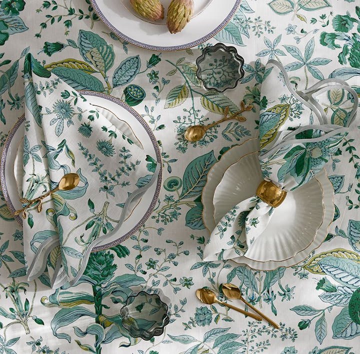 A table featuring Pomegranate, a Matouk Schumacher print.