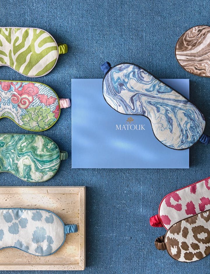 An overhead view of various Matouk Sleep Masks