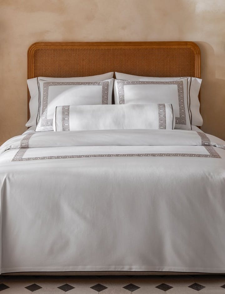 A photograph of Ophelia Pique on a bed.
