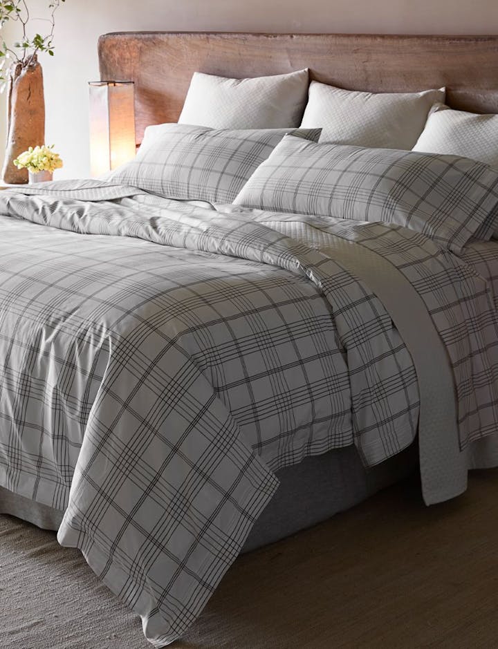 A bed featuring August Plaid linens