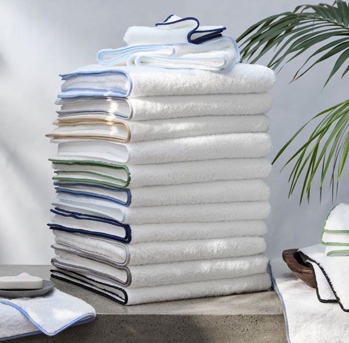 A stack of Cairo towels in an assortment of colors.