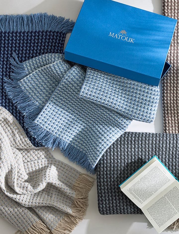 The Cleo Throw shown with a Matouk gift box.